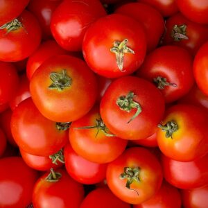 Close-up of fresh red tomatoes showcasing vibrant colors and textures for food enthusiasts.