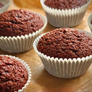 Indulge in freshly baked chocolate muffins, perfect for dessert or a sweet snack at home.