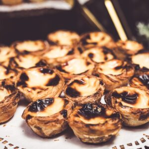Close-up of savory Portuguese pastéis de nata, perfect for dessert lovers.