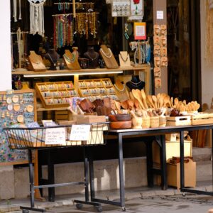 Vibrant display of handcrafted jewelry and wooden items at a shop in İzmir, Türkiye.