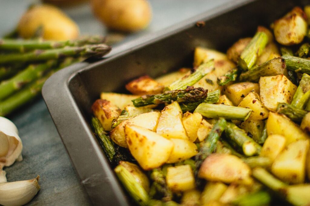 Garlic Butter Asparagus — A Quick & Easy Side Dish Delicious roasted potatoes and asparagus seasoned with spices, perfect for a vegan meal.