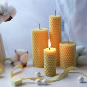 Warm and cozy candlelight scene with aromatic beeswax candles and soft cotton decor, creating a tranquil atmosphere.